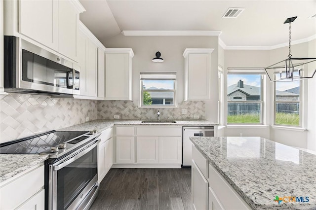 606 Juniper Dr, Troy, TX 76579 - kitchen with appliances with stainless steel finishes, a chandelier, dark wood-type flooring, white cabinets, and light stone counters