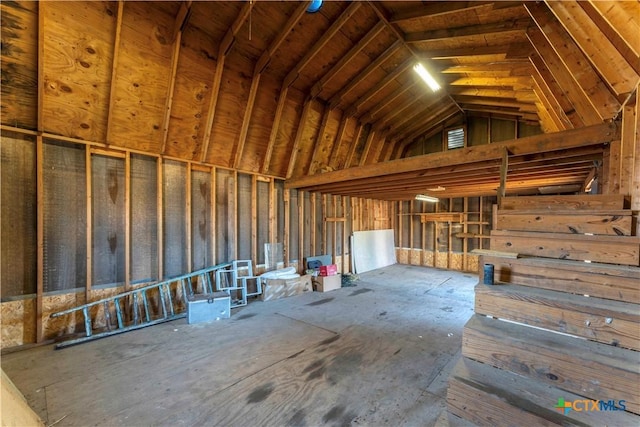 miscellaneous room with high vaulted ceiling