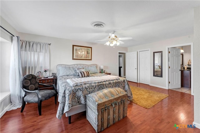 bedroom with wood-type flooring and ceiling fan