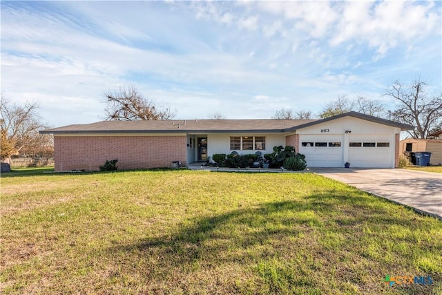 single story home featuring a front yard, an attached garage, brick siding, and concrete driveway