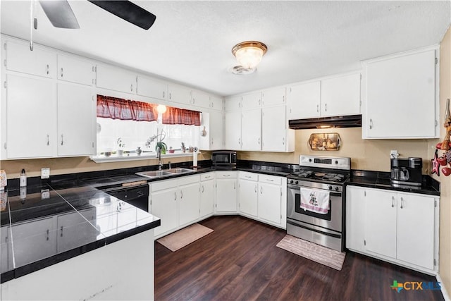 kitchen with dark hardwood / wood-style flooring, a textured ceiling, sink, black appliances, and white cabinetry