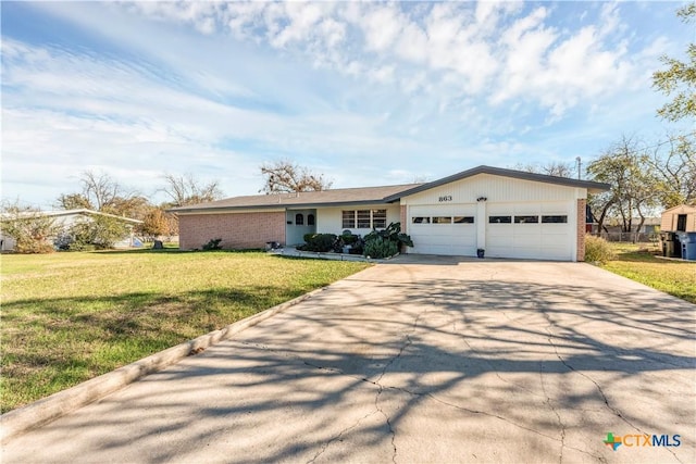 single story home with a garage and a front yard