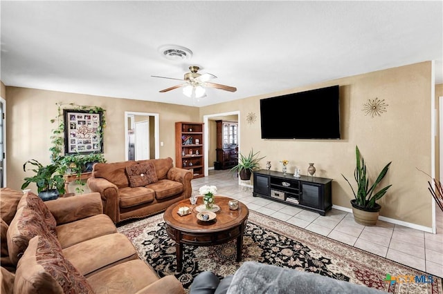 tiled living room with ceiling fan