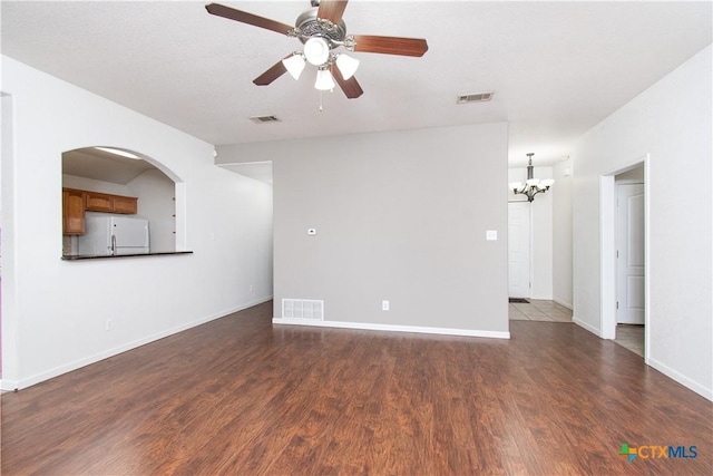 568 Morgans Point Rd, Belton, TX 76513 - unfurnished room with wood finished floors, a chandelier, and a ceiling fan
