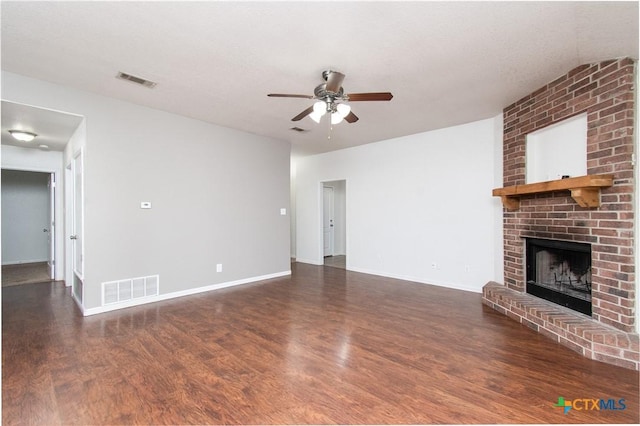 568 Morgans Point Rd, Belton, TX 76513 - unfurnished living room with wood finished floors, a ceiling fan, and a brick fireplace