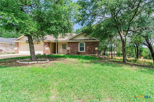 568 Morgans Point Rd, Belton, TX 76513 - single story home with a garage, brick siding, driveway, and a front lawn