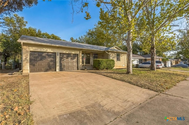 single story home with a garage