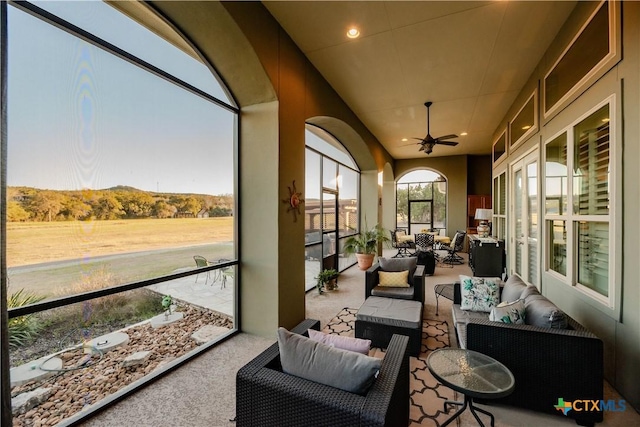 sunroom with ceiling fan