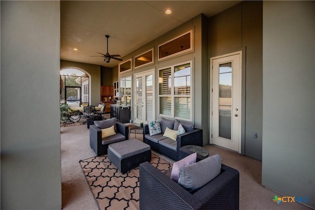 view of patio with ceiling fan and an outdoor living space