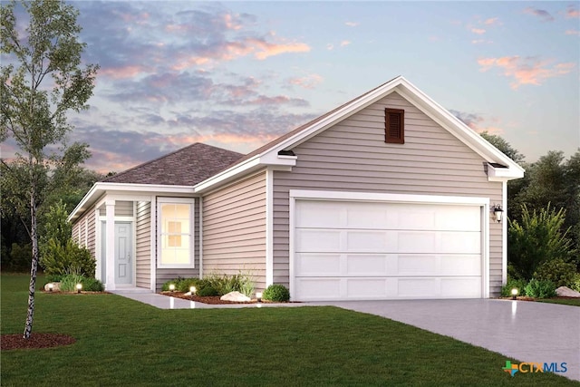 view of front facade featuring a lawn and a garage