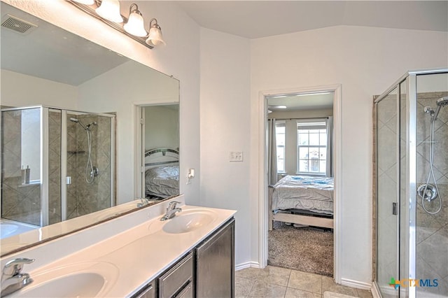 9505 Shimla Dr, Killeen, TX 76542 - full bath featuring ensuite bathroom, lofted ceiling, double vanity, tile patterned flooring, and a shower stall