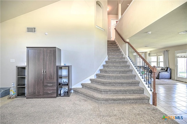 9505 Shimla Dr, Killeen, TX 76542 - stairs featuring a towering ceiling and tile patterned floors