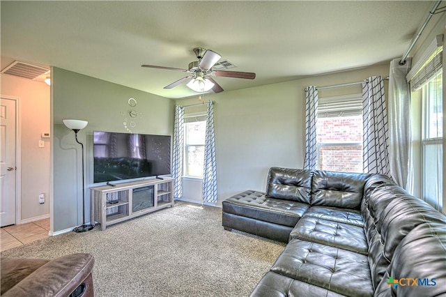 9505 Shimla Dr, Killeen, TX 76542 - living room with healthy amount of natural light, ceiling fan, baseboards, and tile patterned flooring