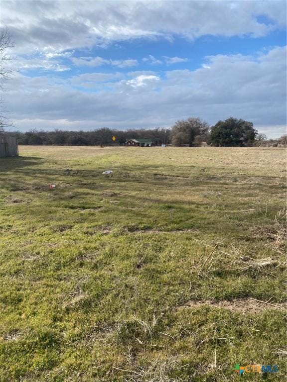 view of yard with a rural view