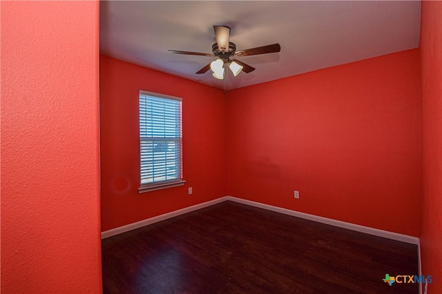 empty room featuring dark hardwood / wood-style floors and ceiling fan