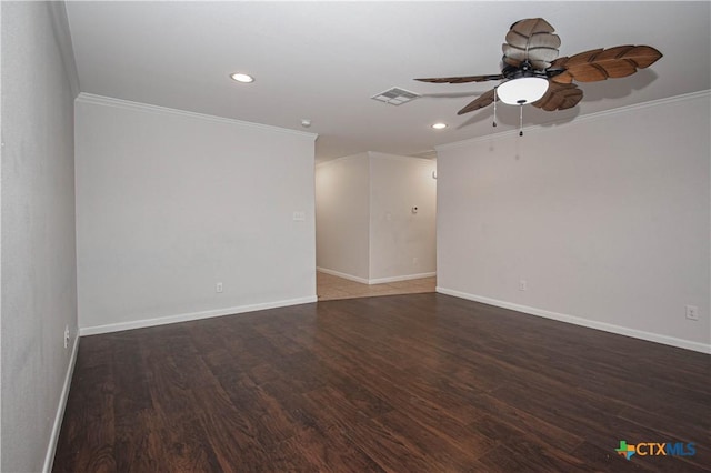 empty room featuring ceiling fan, crown molding, and dark wood-type flooring