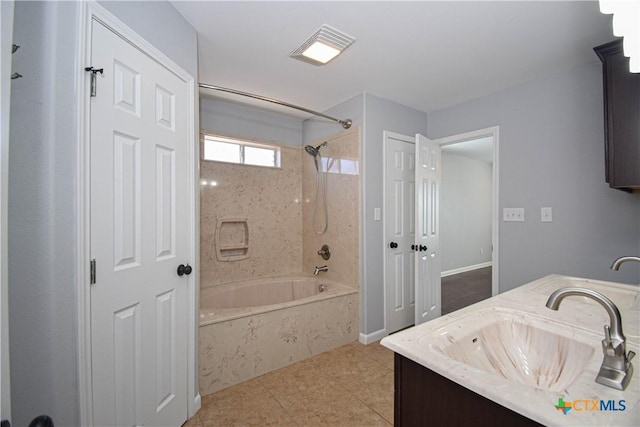 bathroom featuring shower / bathing tub combination, vanity, and tile patterned flooring