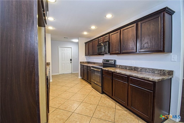 kitchen featuring appliances with stainless steel finishes, dark brown cabinetry, and light tile patterned floors