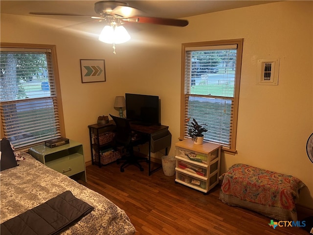 bedroom with dark wood-type flooring and ceiling fan