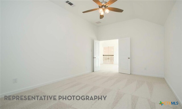 empty room featuring visible vents, high vaulted ceiling, carpet, baseboards, and ceiling fan