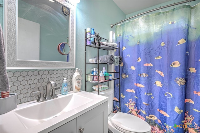 bathroom with decorative backsplash, vanity, toilet, and a shower with shower curtain