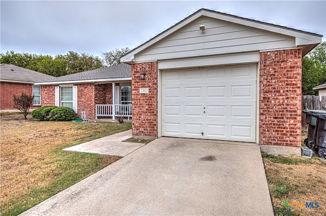 ranch-style home with a front lawn and a garage