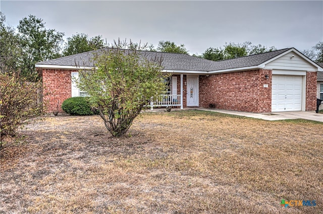 single story home with a porch and a garage