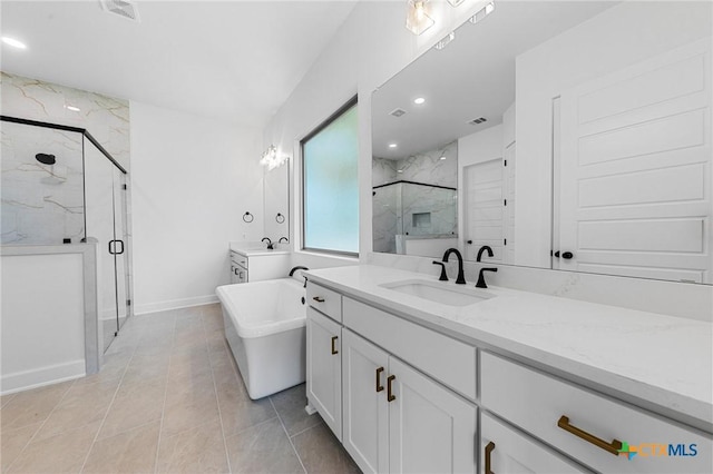 full bath featuring a freestanding tub, a marble finish shower, visible vents, and vanity