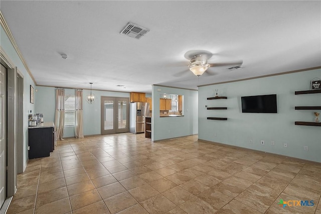 unfurnished living room with ceiling fan, visible vents, crown molding, light tile patterned flooring, and french doors