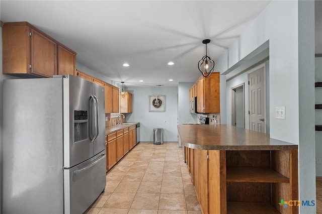 kitchen featuring appliances with stainless steel finishes, open shelves, brown cabinets, a sink, and recessed lighting