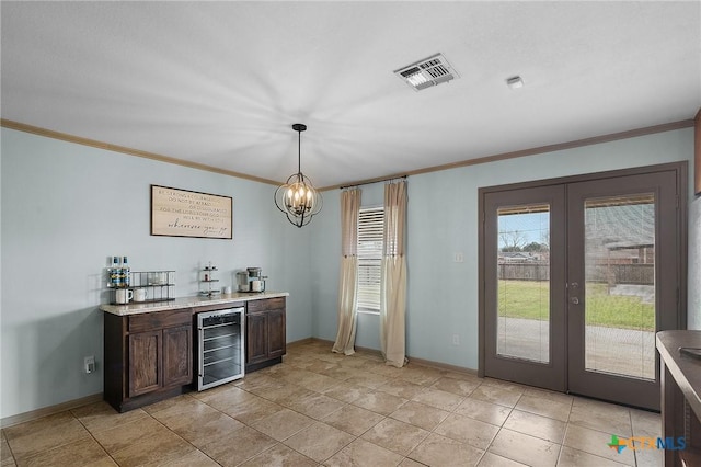 bar with visible vents, ornamental molding, a bar, beverage cooler, and french doors
