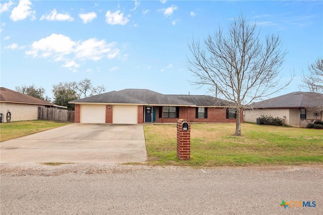 ranch-style house with driveway, a front yard, a garage, brick siding, and fence