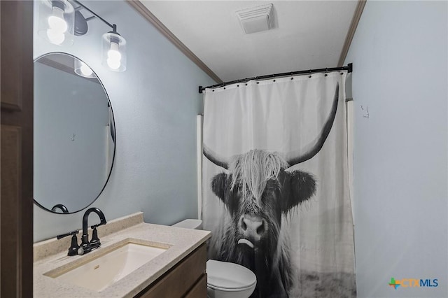 bathroom featuring visible vents, crown molding, vanity, toilet, and a shower with curtain