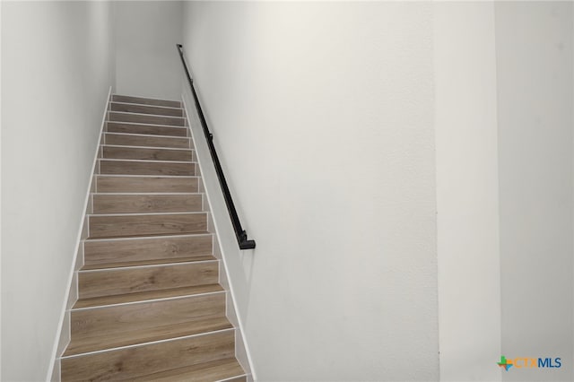 1208 N Academy Ave Unit 3203, New Braunfels, TX 78130 - stairway featuring wood finished floors