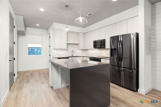 1208 N Academy Ave Unit 3203, New Braunfels, TX 78130 - kitchen with stainless steel refrigerator with ice dispenser, a center island, tasteful backsplash, light wood-style flooring, and pendant lighting