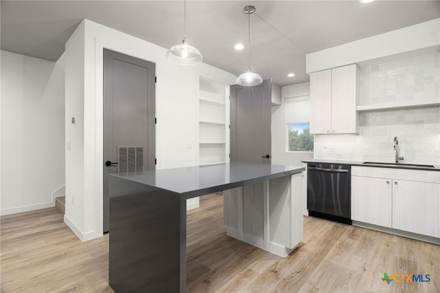 1208 N Academy Ave Unit 3203, New Braunfels, TX 78130 - kitchen with dishwasher, a sink, dark countertops, light wood finished floors, and recessed lighting