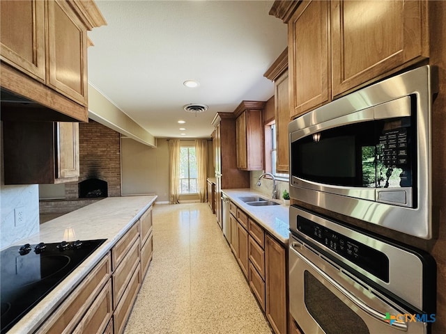 kitchen featuring light countertops, a sink, visible vents, and stainless steel appliances