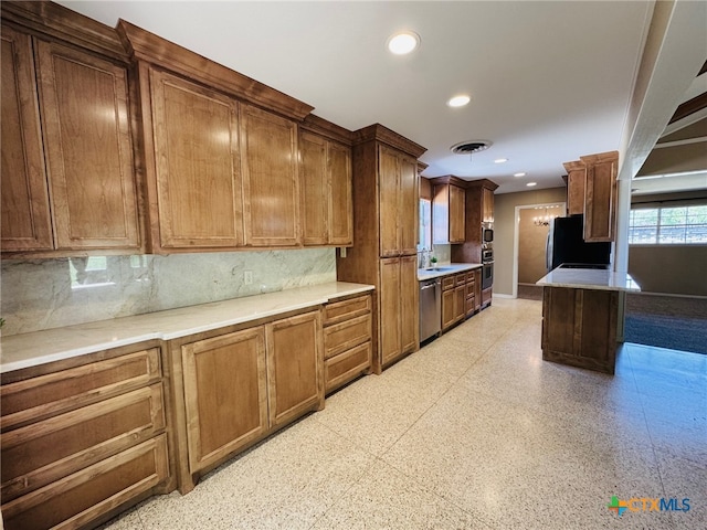 kitchen featuring visible vents, dishwasher, a sink, recessed lighting, and refrigerator