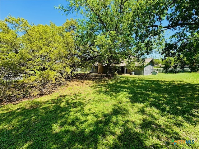 view of yard with fence