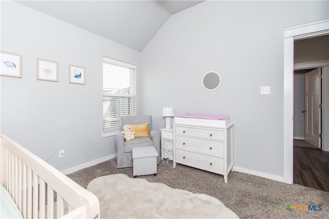 carpeted bedroom with baseboards and vaulted ceiling