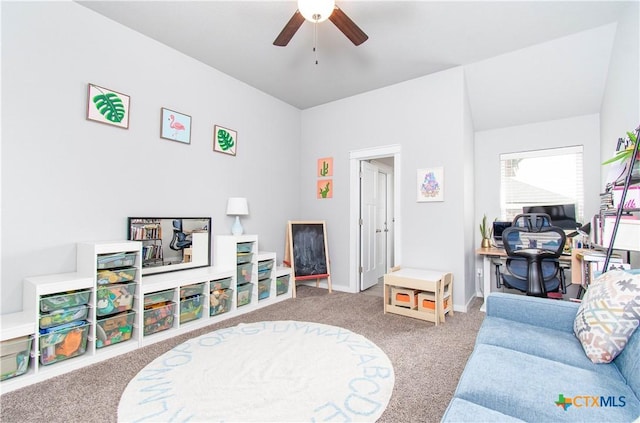 playroom featuring ceiling fan, carpet, and baseboards