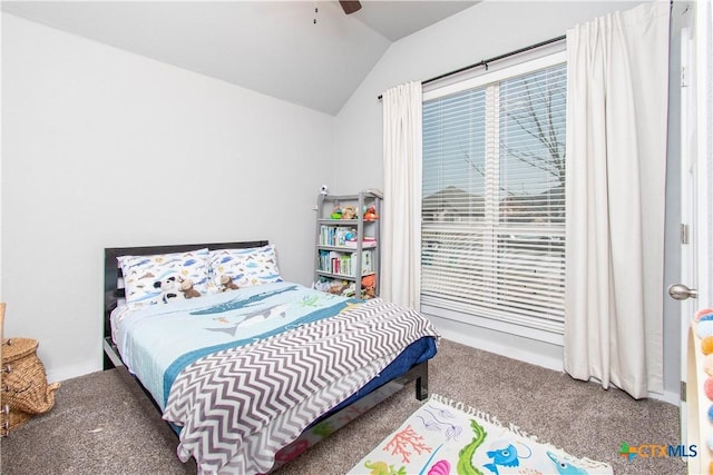 bedroom with lofted ceiling, ceiling fan, and carpet flooring