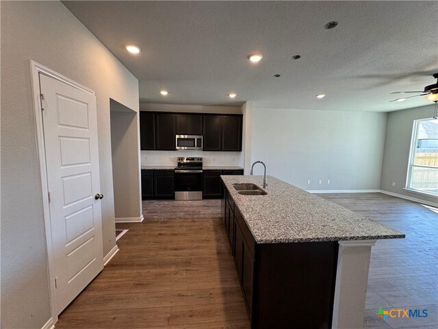 kitchen featuring backsplash and light stone counters