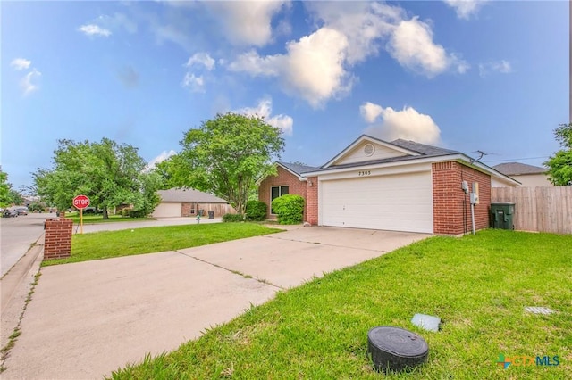 ranch-style house featuring brick siding, a front lawn, an attached garage, and concrete driveway