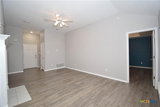 1614 Twisted Oak Dr, Temple, TX 76502 - unfurnished living room featuring a ceiling fan, wood finished floors, baseboards, lofted ceiling, and recessed lighting