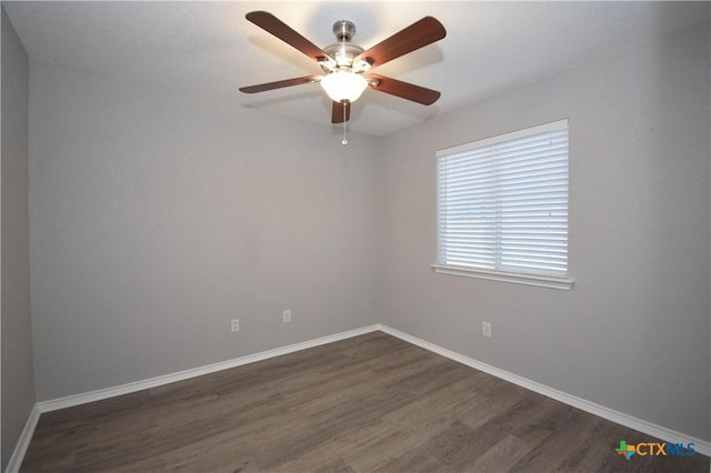 1614 Twisted Oak Dr, Temple, TX 76502 - unfurnished room featuring dark wood-type flooring, baseboards, and a ceiling fan