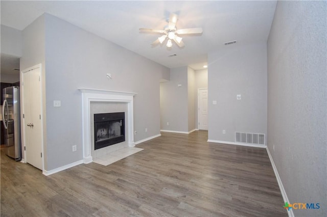 1614 Twisted Oak Dr, Temple, TX 76502 - unfurnished living room featuring a ceiling fan, wood finished floors, and baseboards