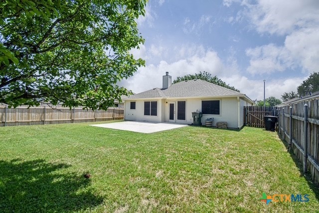 1614 Twisted Oak Dr, Temple, TX 76502 - rear view of property featuring a patio area, a chimney, french doors, and stucco siding