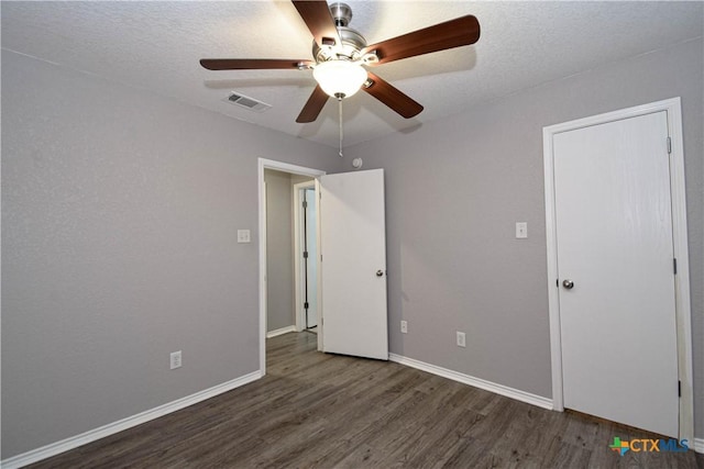 1614 Twisted Oak Dr, Temple, TX 76502 - unfurnished bedroom with wood finished floors, baseboards, and ceiling fan