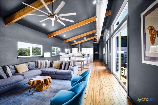 living room featuring beamed ceiling, wood-type flooring, high vaulted ceiling, and ceiling fan